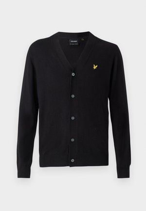 Cardigan noir avec un col en V, des manches longues et une fermeture à boutons. Présente un petit logo jaune brodé sur le côté gauche. Texture douce.