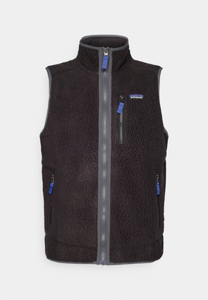 Black fleece vest with high collar, full front zipper, three zippered pockets, and Patagonia logo on left chest.