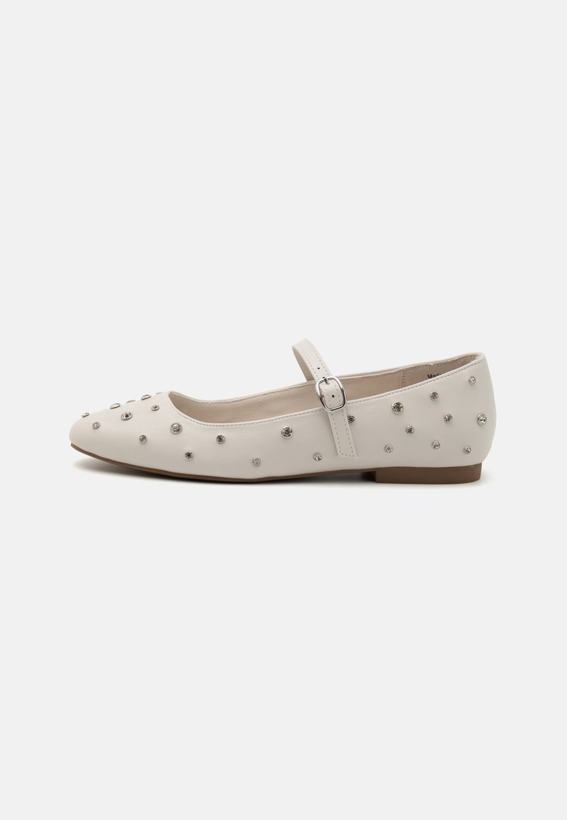 White leather flat shoe with a pointed toe, decorative stud accents, and a buckle strap across the midfoot, featuring a low heel.