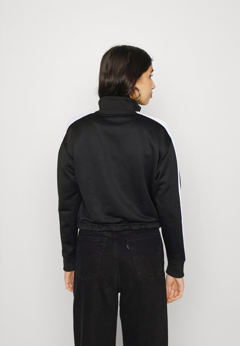 Puma CROP TRACK JACKET - Sportovní bunda - black