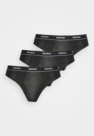 Zwart katoenen stringondergoed set van drie, met een witte "HUGO" logo elastische tailleband, een gladde textuur en een minimalistisch ontwerp.