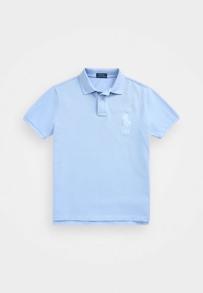 Light blue polo shirt made of cotton, featuring a classic collar, short sleeves, and an embroidered logo on the left chest. Smooth texture.