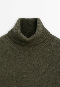 Olive green knitted wool turtleneck sweater with ribbed collar and shoulder detailing on a white background.