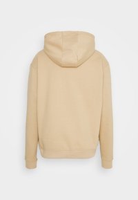 Karl Kani UNISEX SMALL SIGNATURE HOODY  - Sweatshirt com capuz - sand