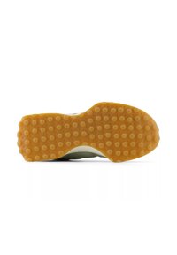 Semelle en caoutchouc avec des motifs circulaires surélevés, de couleur beige-orange. Le dessous présente des zones de grip différenciées pour une meilleure traction.