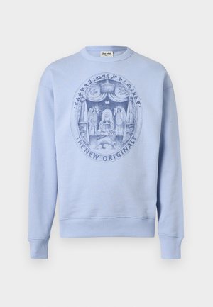 Light blue sweatshirt with round neckline featuring a detailed circular graphic of figures, a throne, a lion, and text "THE NEW ORIGINALS."