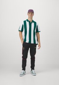 Puma AC MILAN CASUALS PANTS - Klub merchandise - black/for all time red