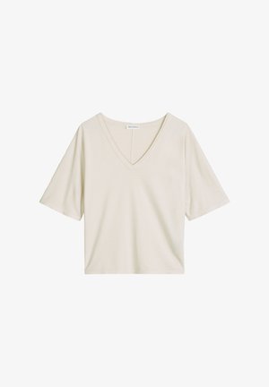 T-shirt ample à manches courtes avec col en V, couleur blanc cassé, ourlet droit, présenté sur un fond blanc.