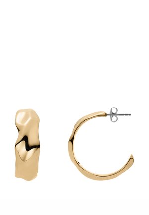 Gold-tone hoop earrings featuring a wavy design with a polished finish. One earring has a textured, irregular shape. Metal post and backing.