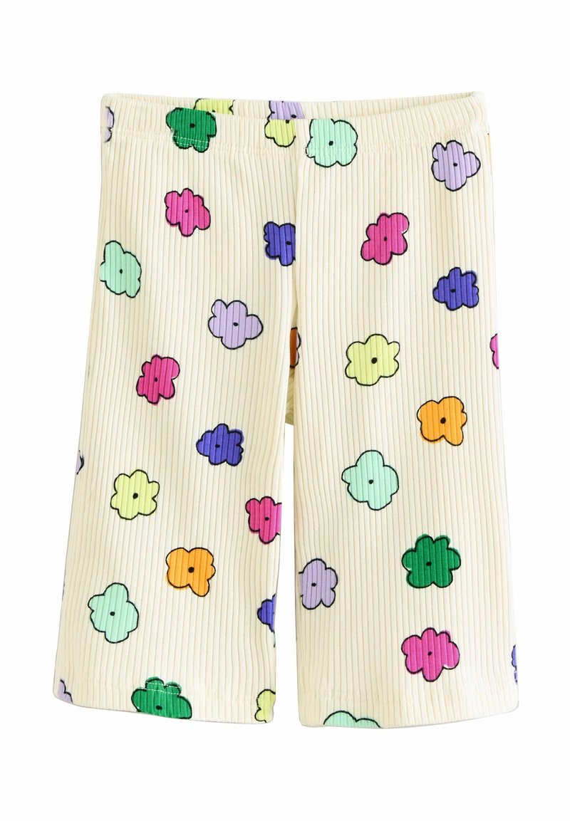 Shorts côtelés couleur crème avec une ceinture élastique présentant des motifs de fleurs dessin animé multicolores en vert, rose, violet, jaune, orange et bleu.