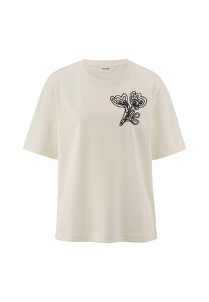 Cremefarbene Baumwoll-T-Shirt mit rundem Ausschnitt und kurzen Ärmeln, versehen mit einem schwarzen gestickten Blätterdesign auf der linken Brust.