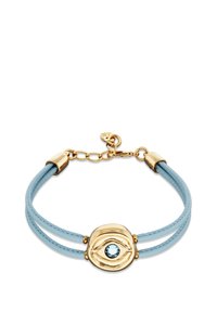 Bracelet en cuir bleu avec ferrures en métal doré et un motif central en forme d'œil orné d'une pierre précieuse bleu clair. Deux lanières flexibles.