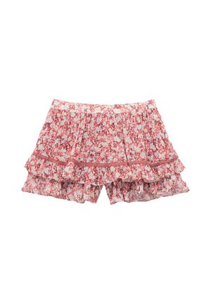 Mini gonna rosa a balze con fiori lilla e bianchi, dotata di vita arricciata e dettagli in pizzo.