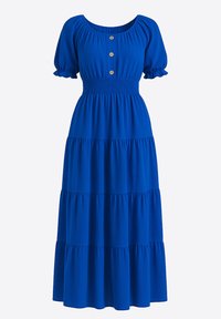 Blå maxiklänning med en rynkad överdel, kort puffärm och knappdetalj vid halsringningen. Har flera lager med volangkant och stretchigt tyg.