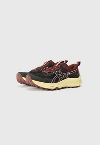 Black and maroon athletic shoes with yellow soles, textured mesh upper, contrasting logo, and rugged outsole designed for traction.