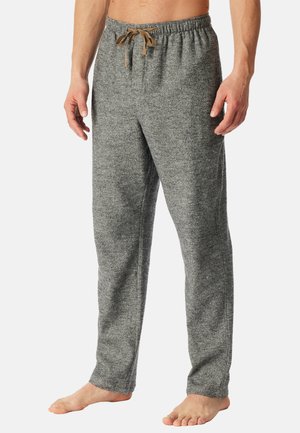 Grijze, gestructureerde joggingbroek met een trekkoord in de taille, met een relaxte pasvorm en zijnaden. Het materiaal lijkt zacht en comfortabel te zijn.