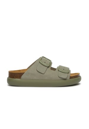 Green suede slide sandal with two adjustable straps, cork footbed, and rubber sole. Features smooth texture and minimalistic design.