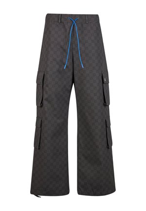 Long cargo pants in black fabric with a pattern. Features oversized pockets, elastic waistband, blue drawstring, and ankle hems.