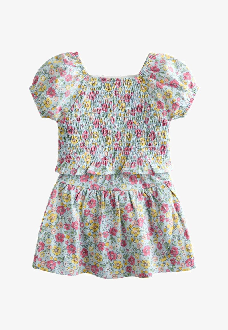 Vestito floreale per bambina con maniche corte a sbuffo, corpetto arricciato, vita con volant e gonna arricciata in colori pastello.