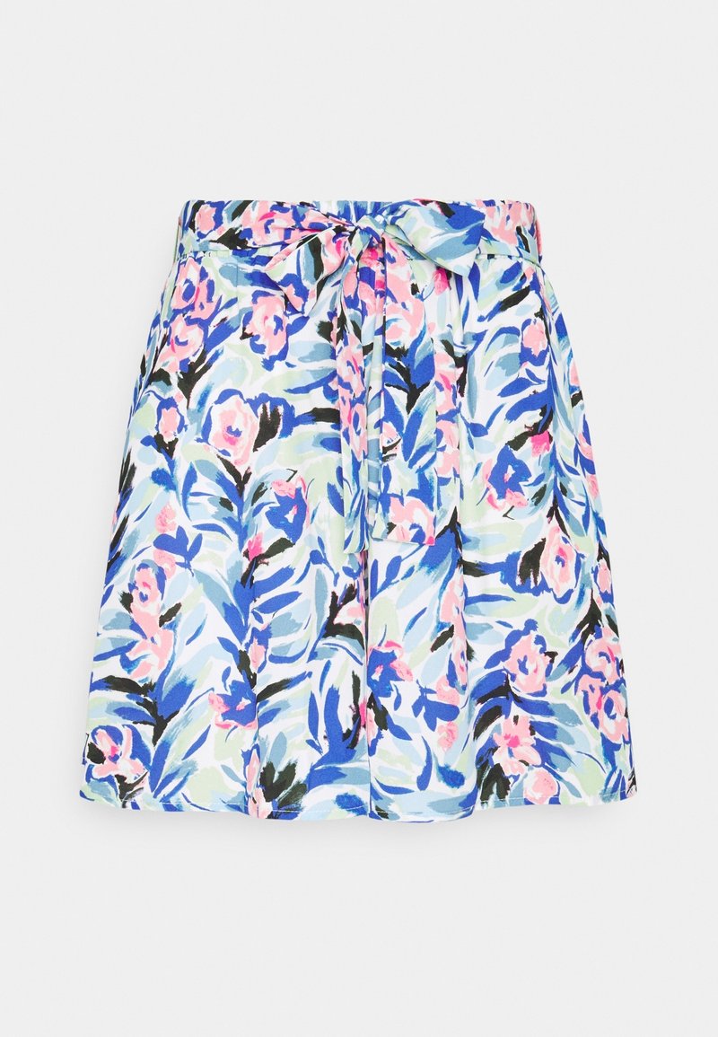 Jupe à motif floral avec des feuilles et des fleurs bleues, roses et vertes, avec un nœud noué à la taille sur fond blanc.
