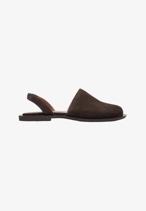 Brown suede slingback shoe with a flat sole, rounded toe, minimal design, and an open back for easy wear.