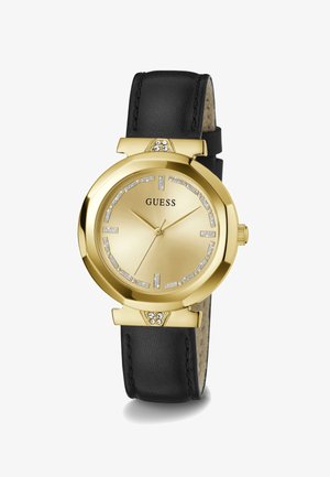 Montre-bracelet Gold Guess avec bracelet en cuir noir, index d’heures en cristal et trois aiguilles dorées indiquant 10:10:37.