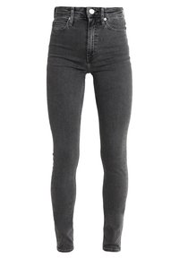Pantalones vaqueros ajustados de cintura alta en denim gris oscuro. Presentan un cierre de botón, cinco bolsillos y una textura suave con mínimas decoloraciones.