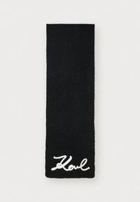 Schwarzer gestrickter Schal mit gerippter Textur. Bezeichnet mit einem weißen gestickten "Karl"-Signatur in der Nähe des unteren Randes. Rechteckige Form und schlichtes Farbdesign.