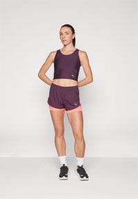 Puma RUN ULTRAFORM CROP TANK W - Linne - midnight plum