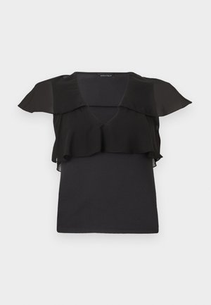 Black sleeveless top with sheer ruffle detail over shoulders and chest, V-neck, and a fitted silhouette.