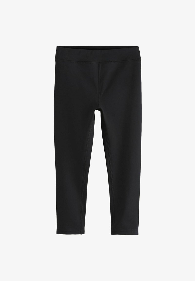 Juodos tamprės, pagamintos iš elastingos medžiagos su lygiu paviršiumi, turinčios aukštą juosmenį ir plokščias siūles, sukurtos patogumui ir lankstumui.