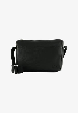 Black rectangular crossbody bag with adjustable strap, textured surface, zipper closure, and small embossed logo on the lower right corner.