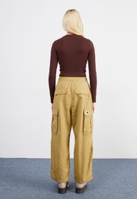 Carhartt WIP JET PANT - Pantalon cargo - agate