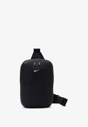 Mochila Nike preta com um design acolchoado, apresentando um bolso frontal, bordas arredondadas e uma alça de ombro, realçada por um logótipo branco.