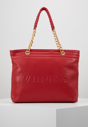 Red leather tote bag with a braided red handle and gold chain accents. Features embossed "VALENTINO" logo on the front and stitched detailing.