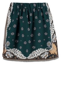 Groene rok met een bloemen- en stippenpatroon, elastische tailleband en contrasterende randen met ingewikkelde details in wit en bruin.