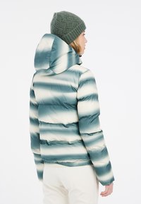 Padded Jacke mit Kapuze, ausgestattet mit einem Verlaufstreifenmuster in Türkis und Creme. Strukturierter Stoff mit elastischen Bündchen und Saum.