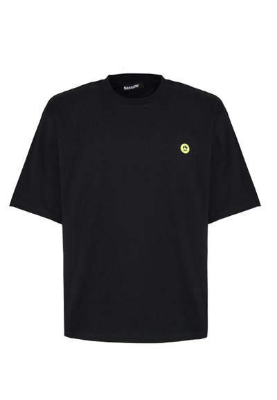 T-shirt en coton noir à manches courtes, col rond et avec un petit logo de smiley jaune sur la poitrine gauche.