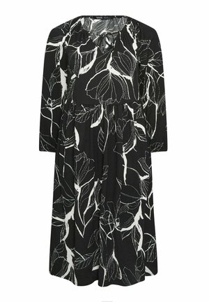 Czarna sukienka z białym kwiatowym wzorem, długimi rękawami, dekoltem w kształcie V z detalem wiązania oraz szwem w talii, oferująca swobodny krój.