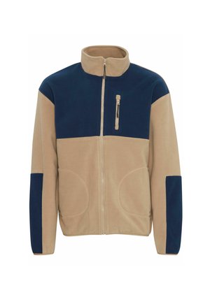 Fleecejacke mit halbem Reißverschluss, in Beigen und Marineblau farblich unterteilt, zwei Fronttaschen und einer Reißverschlusstasche auf der Brust. Weiche Textur.
