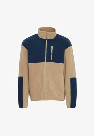 Fleecejacke mit halbem Reißverschluss, in Beigen und Marineblau farblich unterteilt, zwei Fronttaschen und einer Reißverschlusstasche auf der Brust. Weiche Textur.