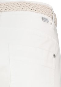 White pants featuring a braided beige waistband, a visible rear pocket with metal snap, and a subtle texture in the fabric.