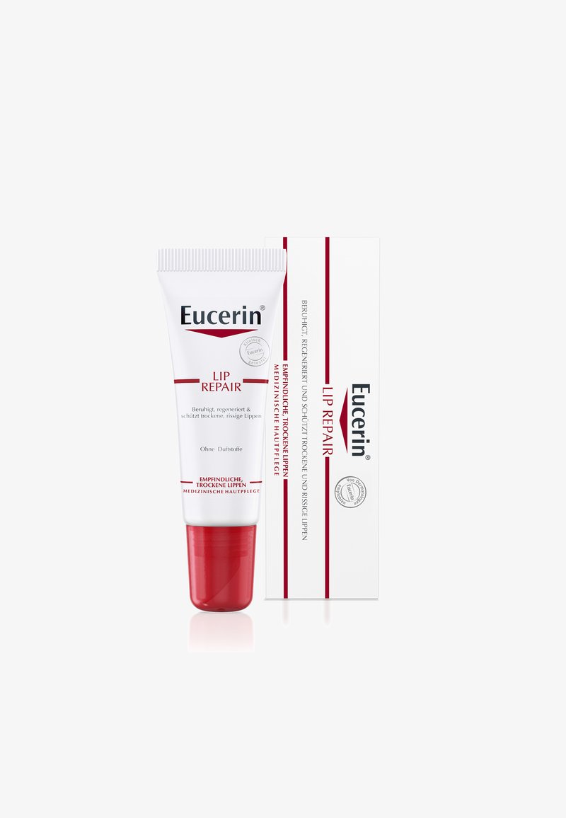 Eucerin Lip Repair tube with red cap next to white box, designed for sensitive, dry, and cracked lips, with German text on packaging.