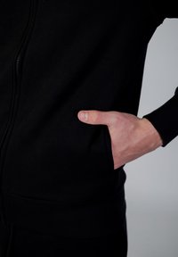 GAS LUSTIG POCKET - Sweater met rits - black