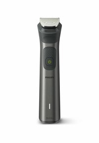 Philips trimmer in matte dark grey plastic, featuring a textured grip, power button, and a silver cutting head with grooves. Waterproof design.