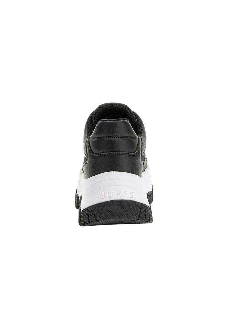 Sneaker in pelle nera con una suola intermedia bianca, caratterizzata da una suola in gomma testurizzata e un marchio visibile sul retro. Forma arrotondata e collare imbottito.