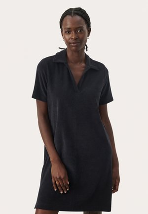 Marineblaues Poloshirt-Kleid aus Terry mit kurzen Ärmeln, V-Ausschnitt und lässiger Passform. Weicher Stoff und minimales Design.