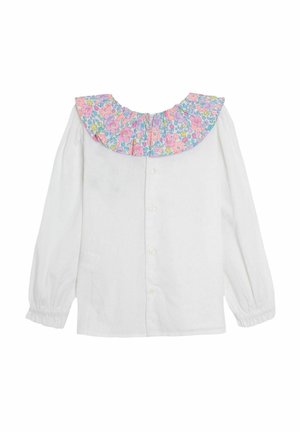 Chemise blanche en tissu avec des manches longues, arborant un col à motifs floraux froncé en rose, violet et bleu. Fermeture par boutons sur le devant.