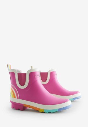 Roosa kummist vihmakeeled valgete aktsentidega, külgedel vikerkaare disain ja mitmevärviline tekstureeritud tallad.