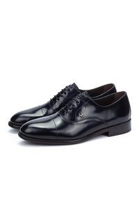 Pair of polished black leather lace-up men's dress shoes with cap toes on a white background.